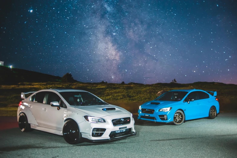 a couple of cars parked next to each other, unsplash contest winner, guardians of the galaxy style, subaru, square, night photo