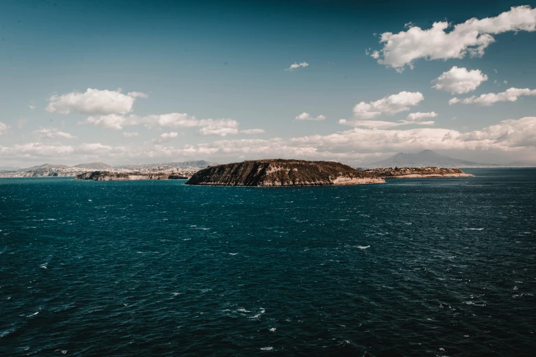 a small island in the middle of the ocean, pexels contest winner, les nabis, mediterranean vista, blueish tones, high quality image”, manly