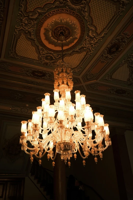a chandelier hanging from the ceiling in a room, inspired by Mihály Munkácsy, museum light, 2 5 6 x 2 5 6 pixels, beautiful aesthetic lighting, dramatic lighting - n 9