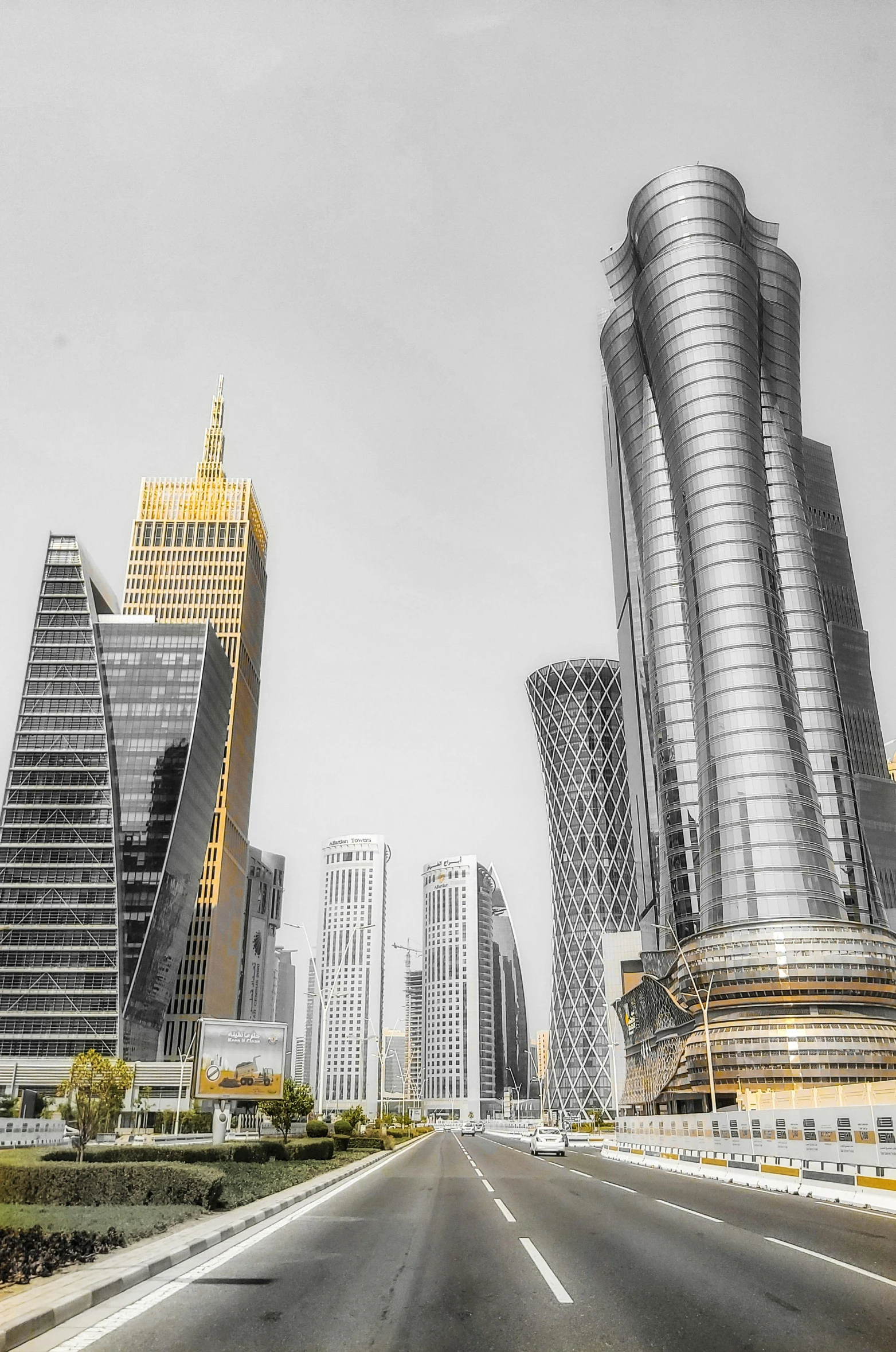 a black and white photo of a city with tall buildings, by derek zabrocki, arabia, shades of yellow, hdr smooth, pastel'