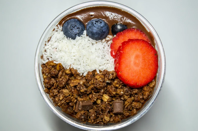 a close up of a bowl of food with strawberries and chocolate, detailed product image, far view, the god of oatmeal, bronze