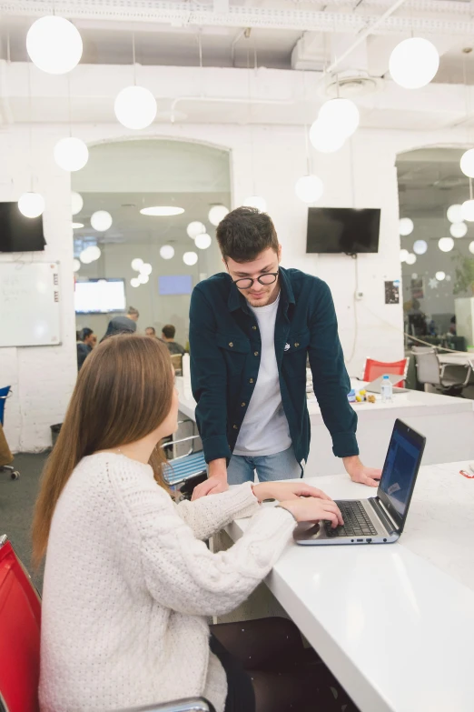 a couple of people sitting at a table with laptops, by Adam Marczyński, trending on unsplash, standing on a desk, 9 9 designs, white backround, in office