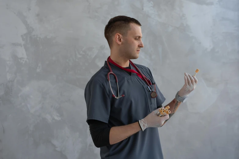 a man with a stethoscope holding a donut, by Adam Marczyński, pexels contest winner, hyperrealism, holding wand, right hand side profile, medic, cast