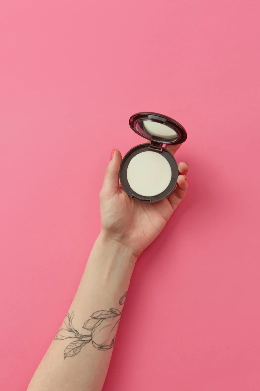 a woman holding a compact compact compact compact compact compact compact compact compact compact compact compact compact compact, inspired by Elsa Bleda, trending on pexels