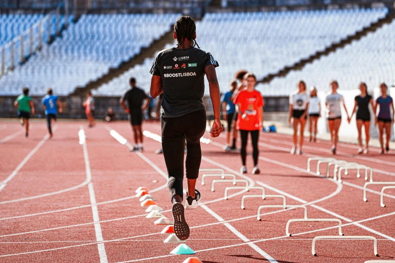 a group of people running on a track, hurufiyya, worksafe. instagram photo, imaan hammam, in spain, game ready