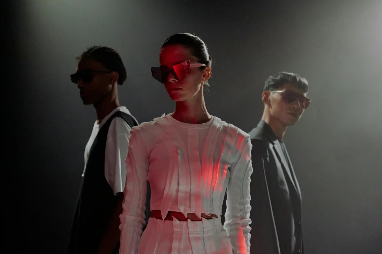 a couple of people standing next to each other, a digital rendering, pexels contest winner, bauhaus, fashion studio lighting, futuristic sunglasses, 3 actors on stage, gorgeous volumetric lighting