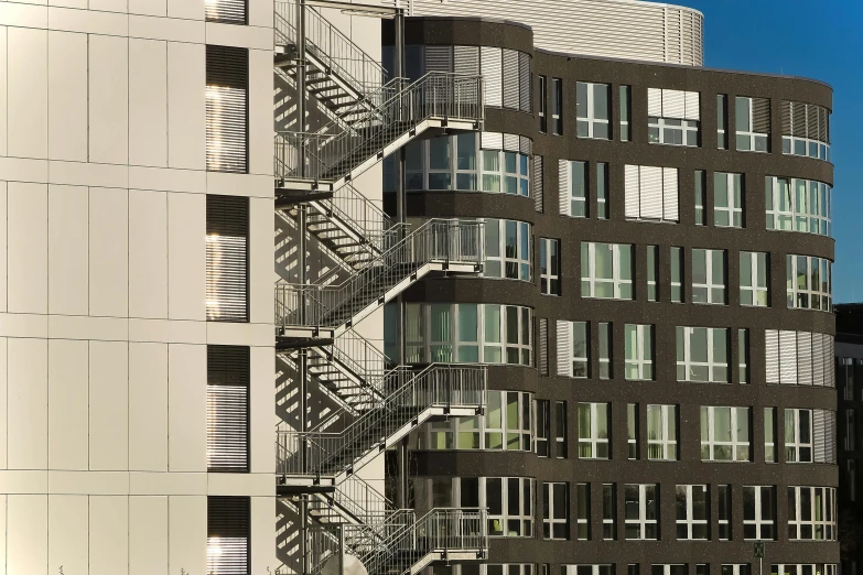 a very tall building with a bunch of windows, by Washington Allston, unsplash, bauhaus, penrose stairs, hyperdetail, seattle, [ 4 k photorealism ]