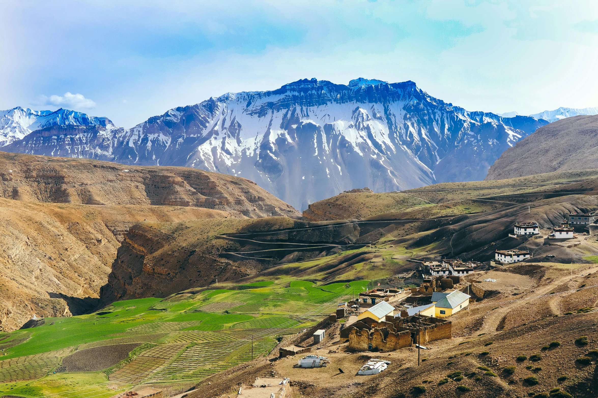 a village in the middle of a valley with mountains in the background, pexels contest winner, hurufiyya, himalayas, background image, sandfalls, youtube thumbnail