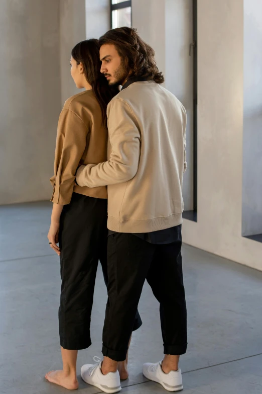 a man and a woman standing next to each other, by Jan Tengnagel, trending on unsplash, renaissance, wear's beige shirt, open jacket, profile pose, wearing pants