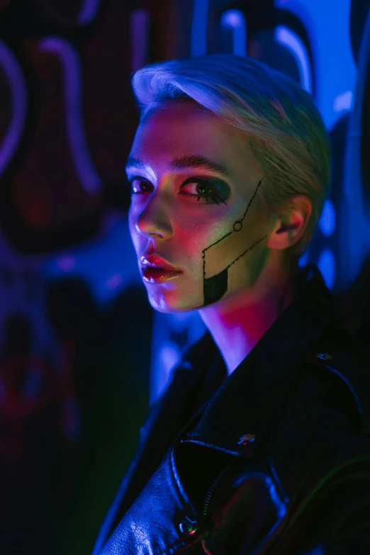 a woman with makeup and piercings standing in front of a wall, cyberpunk art, holography, day - glow facepaint, who is a male android, blade runner lighting, annie leonhart in a neon city