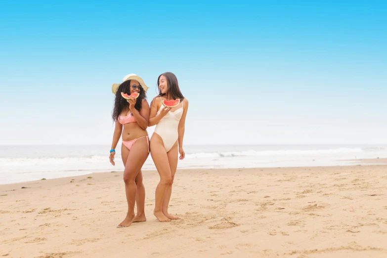 a couple of women standing on top of a sandy beach, latinas, brown, woman is curved, gen z