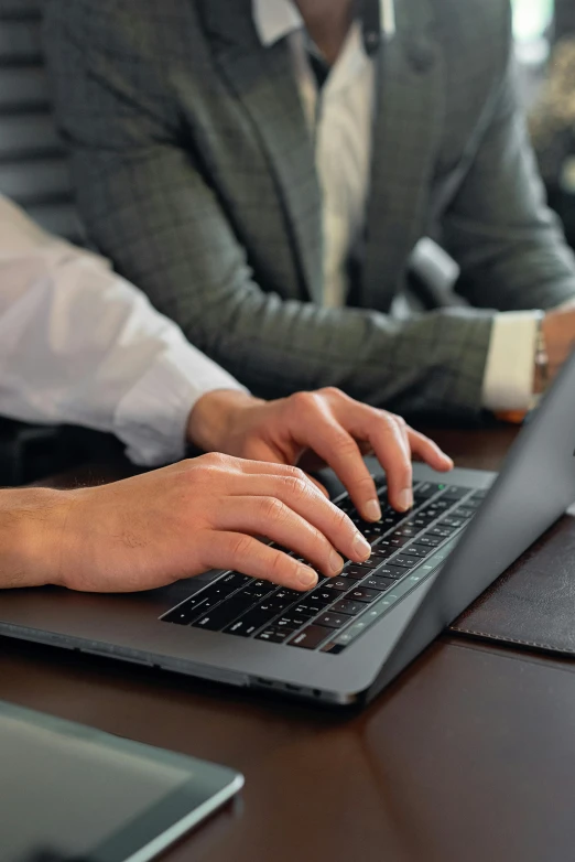 a close up of a person typing on a laptop, in meeting together, professional grade, thumbnail, hunting