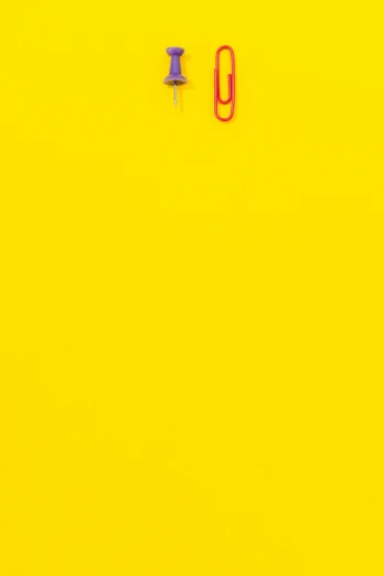 a pair of scissors sitting on top of a yellow surface, by Peter Alexander Hay, postminimalism, red yellow, hanging, pop colors, kim hyun joo