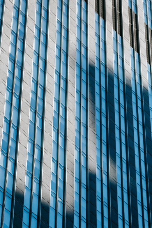 a very tall building with a lot of windows, by Doug Ohlson, pexels contest winner, glowing tiny blue lines, morning detail, glossy reflections, square lines