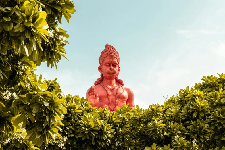 a red statue sitting on top of a lush green field, pexels contest winner, samikshavad, covered in coral, 🦩🪐🐞👩🏻🦳, indian god, realism | beeple