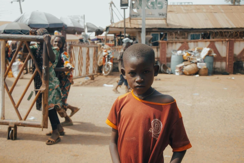 a little boy that is standing in the dirt, pexels contest winner, standing in a township street, obunga, slightly pixelated, market