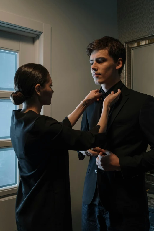 a woman helping a man fix his tie, pexels contest winner, wearing fantasy formal clothing, tom holland, ( ( theatrical ) ), wonbin lee