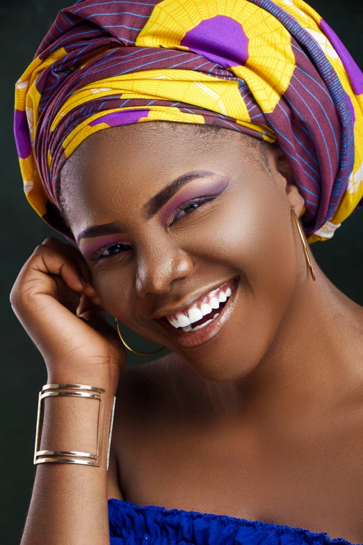 a smiling woman with a turban on her head, an album cover, inspired by Chinwe Chukwuogo-Roy, trending on pexels, alluring plus sized model, fierce expression 4k, multicolored, close-up shoot