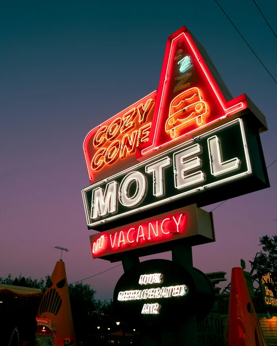 a motel sign is lit up at night, by Carey Morris, pexels contest winner, retrofuturism, cone, profile image, lgbtq, 1999 photograph