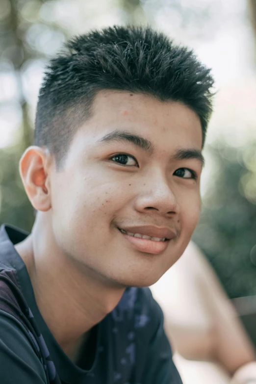 a close up of a person with a cell phone, inspired by Ryan Yee, pexels contest winner, sumatraism, boyish face, smiling and looking directly, headshot profile picture, lgbtq