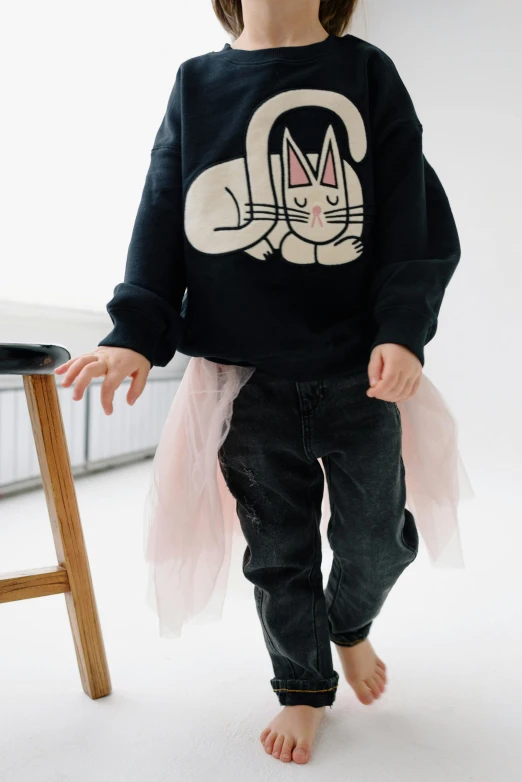 a little girl standing in front of a chair, a cartoon, by Nina Hamnett, trending on unsplash, wearing jeans and a black hoodie, the bunny has pink fur, ballet style pose, acid wash layering