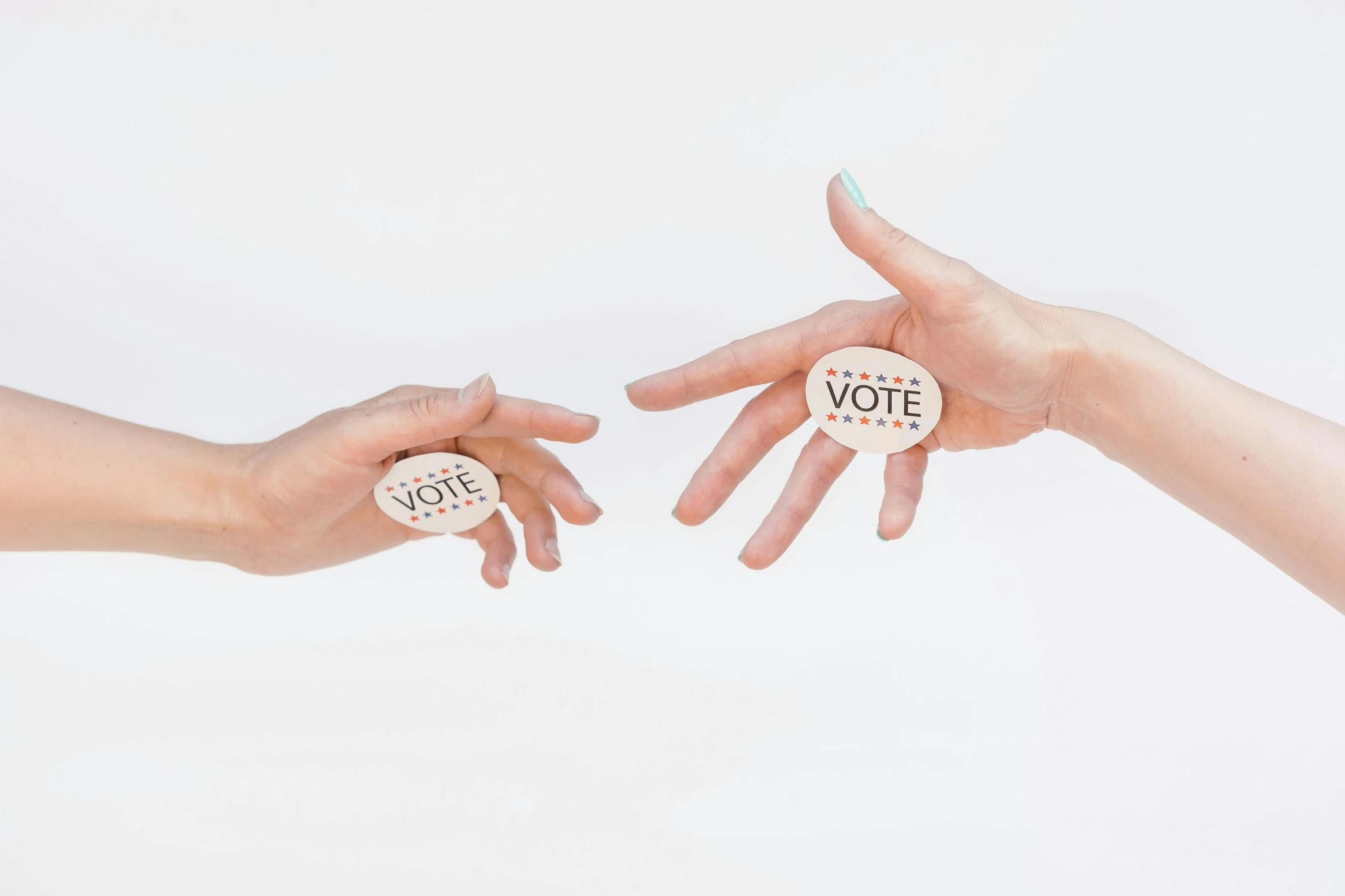 two hands reaching for a button with the word vote on it, by Arabella Rankin, interactive art, trending on dezeen, etsy stickers, pr shoot, set against a white background