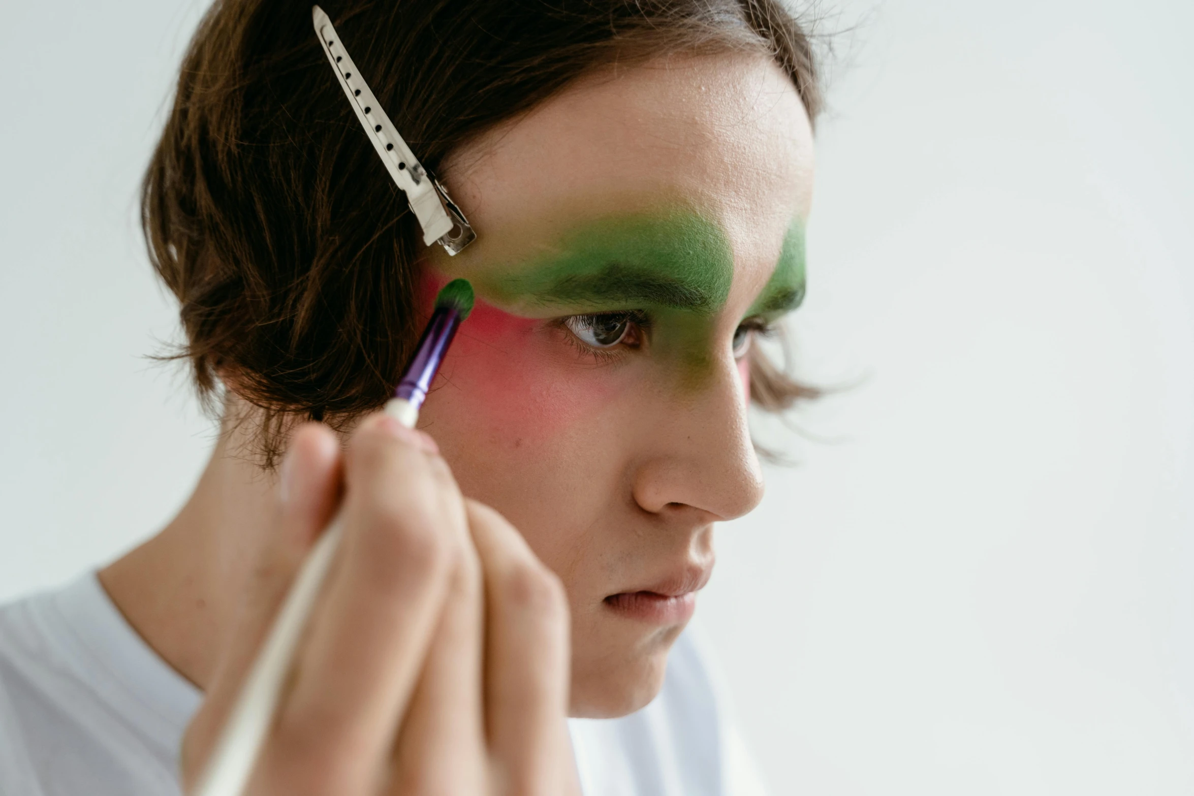 a close up of a person with a pair of scissors, a hyperrealistic painting, inspired by Artemisia Gentileschi, trending on pexels, putting makeup on, pink and green, painted with colour on white, avatar image