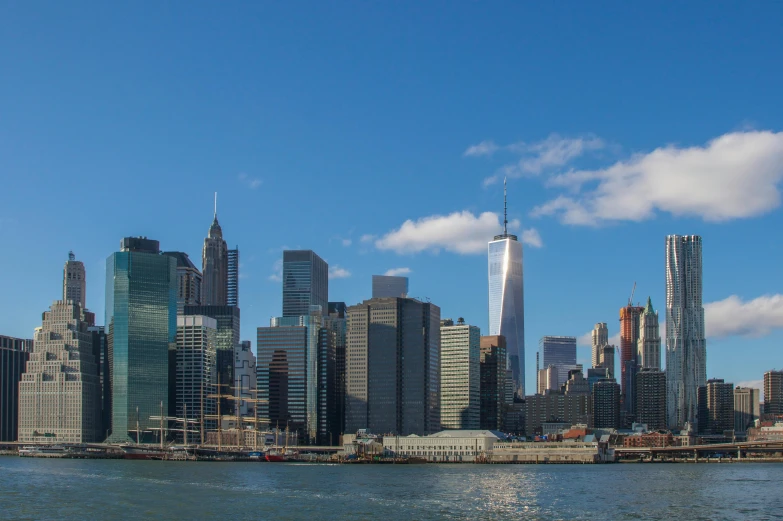 a large body of water with a city in the background, pexels contest winner, hudson river school, frank gehry, panoramic, fan favorite, gigapixel photo