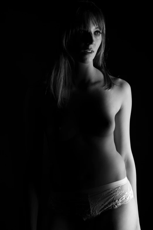 a black and white photo of a woman in underwear, a black and white photo, inspired by Peter Basch, flickr, glowing in the dark, self - portrait!!!!, in white clothes, perfect female body silhouette