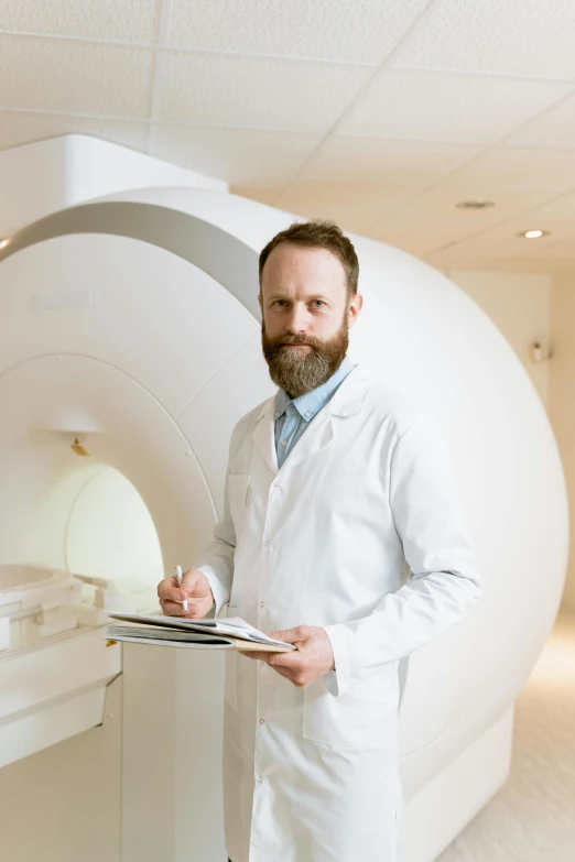 a man in a lab coat holding a clipboard, a picture, by Anton Lehmden, mri, bjørn skalldrasson, male with halo, medium-shot