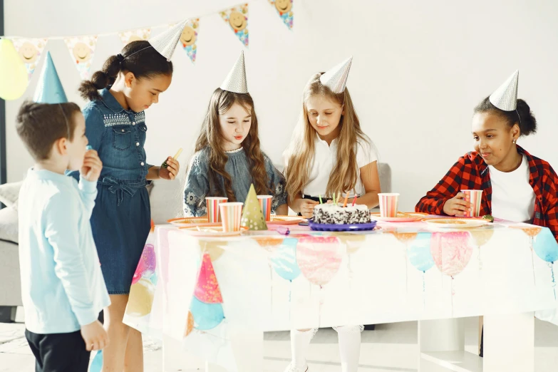 a group of children at a birthday party, by Elaine Hamilton, pexels, on a white table, profile image, modelling, multiple stories