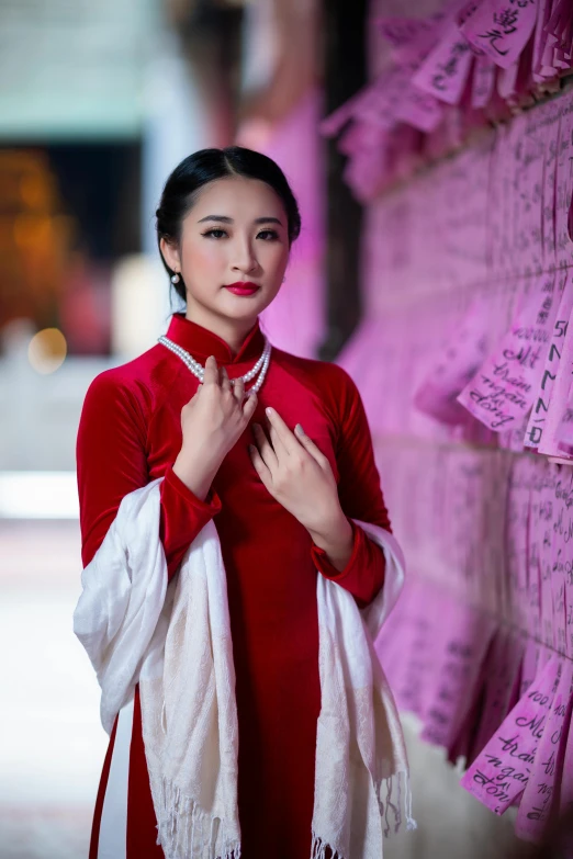 a woman in a red dress posing for a picture, a portrait, inspired by Xu Xi, pexels contest winner, complex background, late evening, promotional image, ( ( theatrical ) )