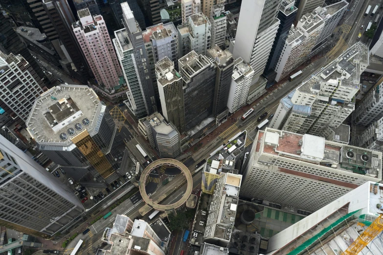 a view of a city from the top of a building, inspired by Thomas Struth, pexels contest winner, photorealism, circle pit, street of hong kong, maze of streets, half turned around