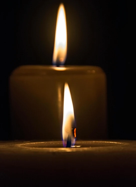two lit candles sitting side by side in the dark, an album cover, profile image, ignant, mourning, paul barson