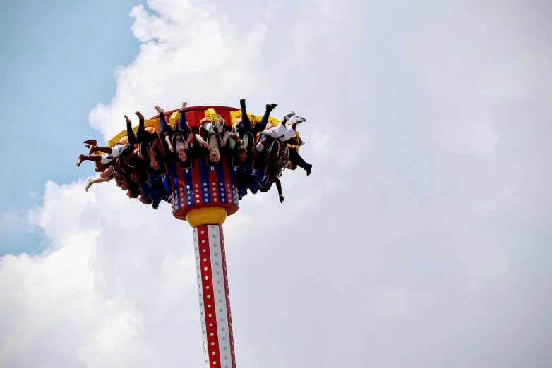 a group of people sitting on top of a ride, in the air, profile image, 1km tall, thunderous