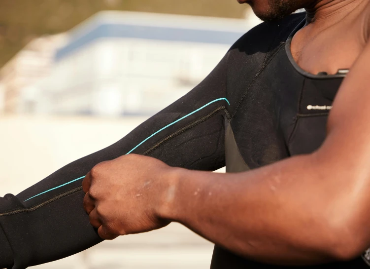 a close up of a person wearing a wet suit, hydration, scaled arm, visible stitching, man is with black skin