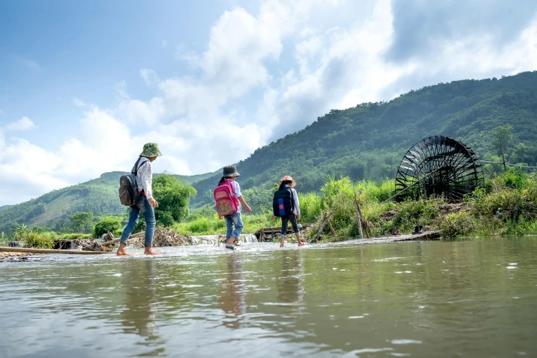 a group of people walking across a river, pexels contest winner, sumatraism, korean countryside, avatar image