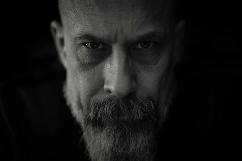 a black and white photo of a man with a beard, a character portrait, unsplash, bauhaus, bruce willis, tim booth, ultra detailed portrait, portrait shot 8 k