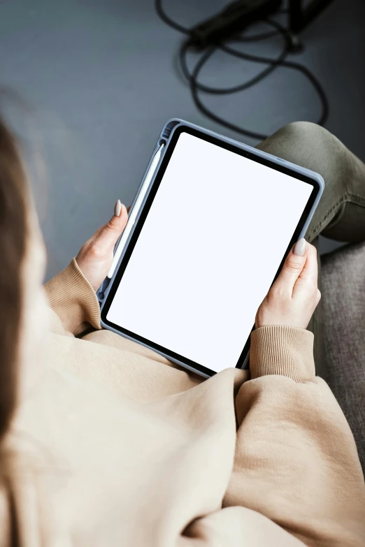 a woman sitting on a couch holding a tablet computer, trending on pexels, computer art, square, close up half body shot, blank, digital banner