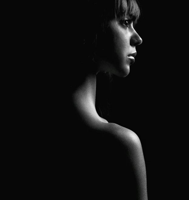 a black and white photo of a woman, a black and white photo, by Andrew Domachowski, portrait of max caulfield, black background pinterest, body and head in view, dark black porcelain skin