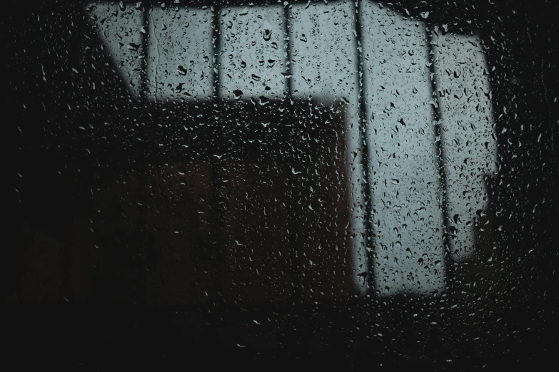 a close up of a window with rain on it, inspired by Elsa Bleda, unsplash, visual art, ☁🌪🌙👩🏾, chilly dark mood, wet reflections in square eyes, depressed mood