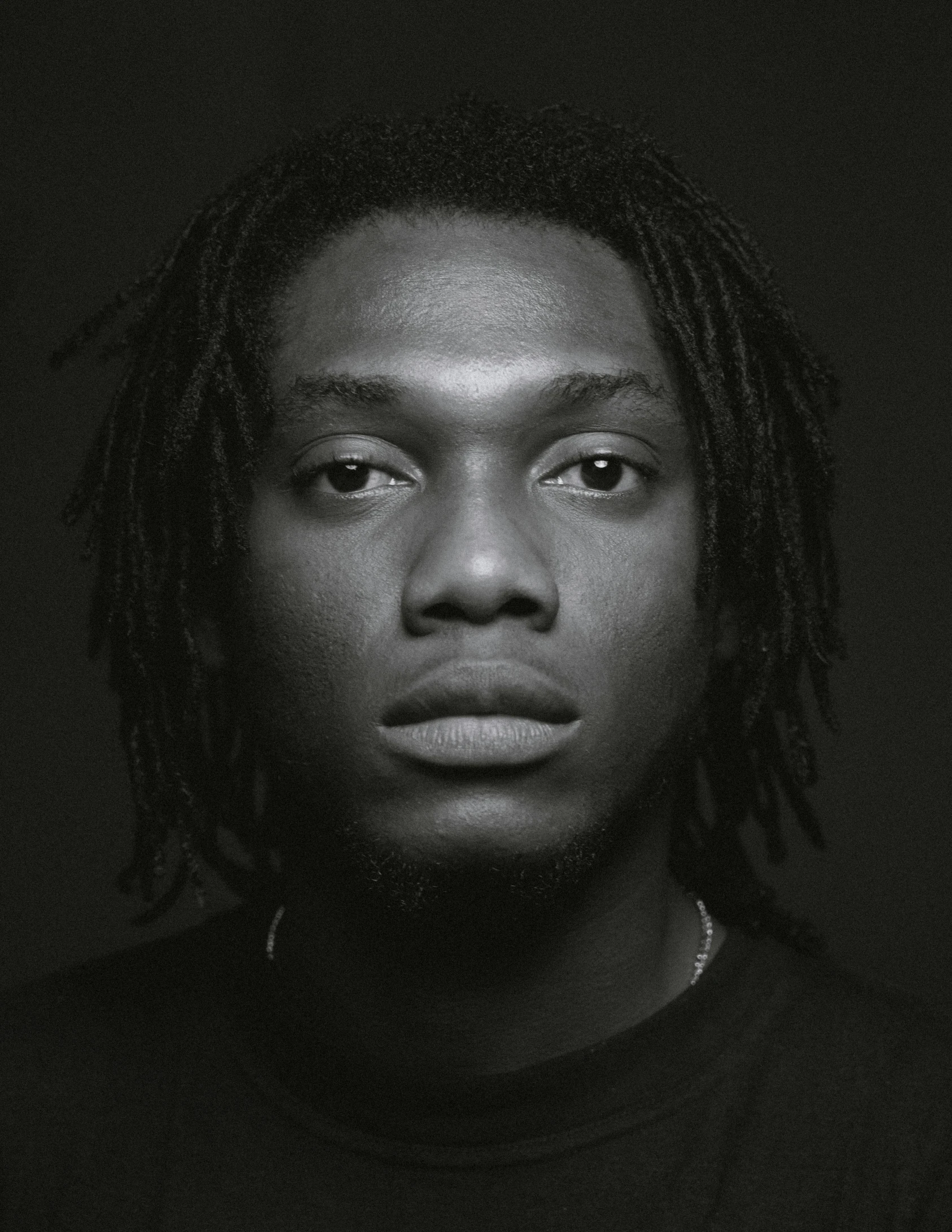 a black and white photo of a man with dreadlocks, an album cover, unsplash, renaissance, offset and takeoff, ceo, pout, tyler