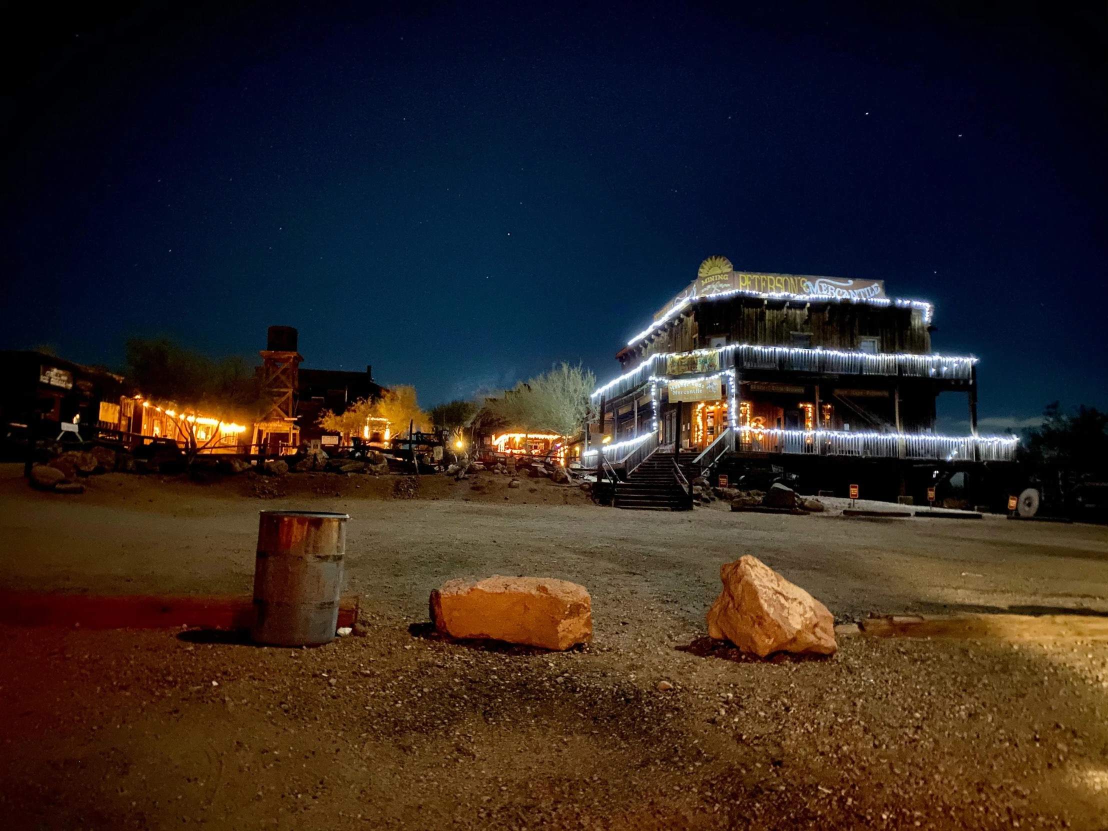 a truck that is sitting in the dirt, by Daniel Lieske, pexels contest winner, western saloon theme, neon ancient ruins, background image, victorian harbour night