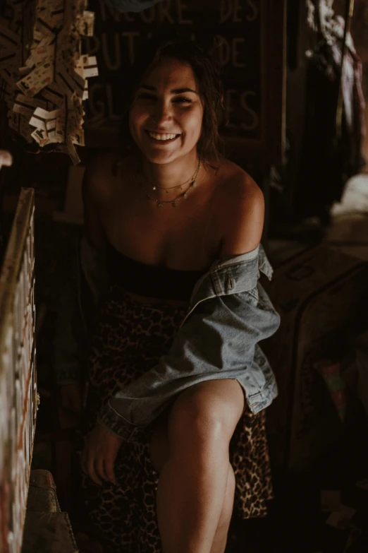 a woman sitting on a chair in a room, a picture, trending on unsplash, with a seductive smile, daisy dukes, low quality grainy, smiling down from above