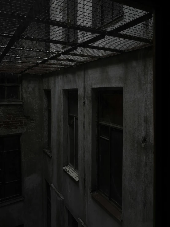 a black and white photo of a building, inspired by Katia Chausheva, unsplash contest winner, shady dark backalley at night, high level texture render), view out of a window, webgl render