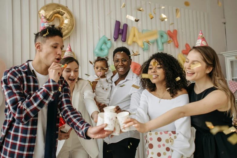 a group of people standing around a birthday cake, pexels contest winner, diverse outfits, promo image, people enjoying the show, background image