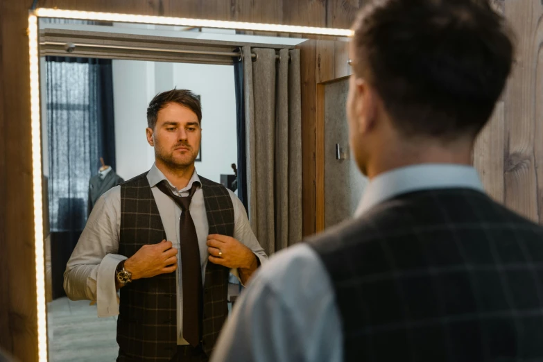 a man adjusting his tie in front of a mirror, by Adam Marczyński, pexels contest winner, wearing business casual dress, full-figure, lachlan bailey, avatar image