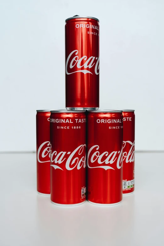 three coca cola cans stacked on top of each other, a picture, by Tom Wänerstrand, hyperrealism, 6 pack, taken in 2022, ultra rare, 2654465279