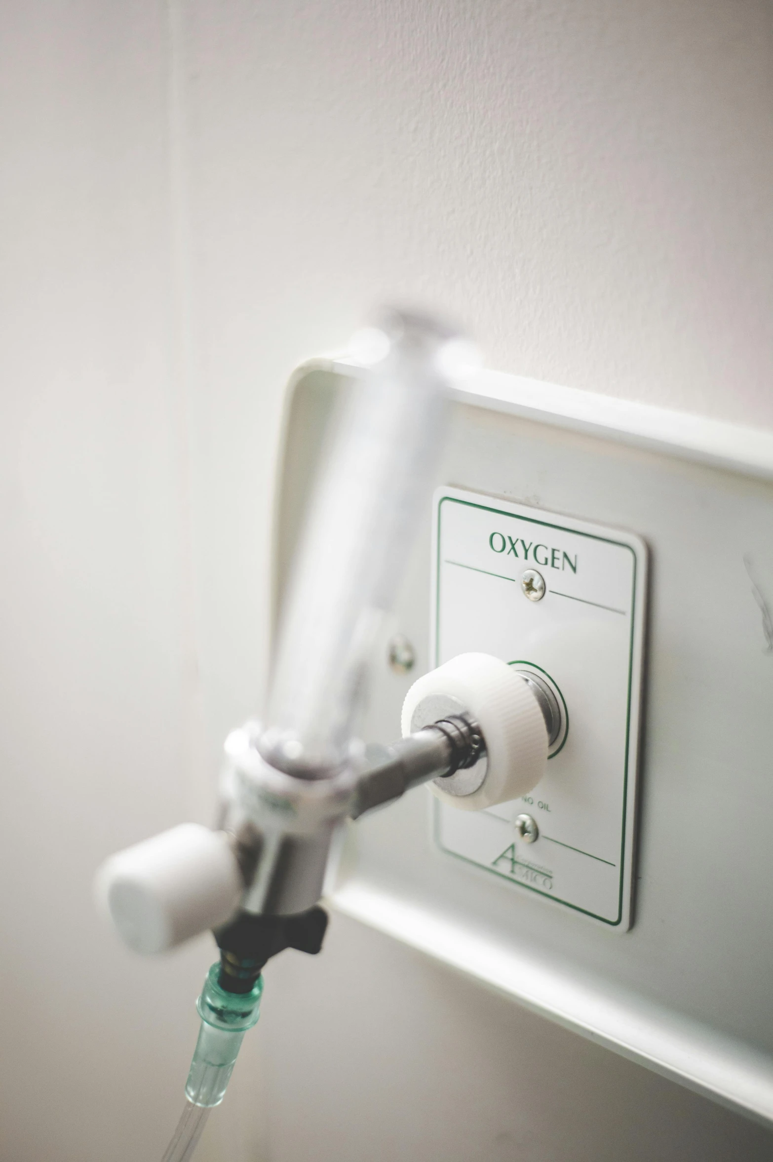 a medical device hooked up to a wall, by Bryan Organ, unsplash, happening, oxygen tank, white, high angle close up shot, instagram photo