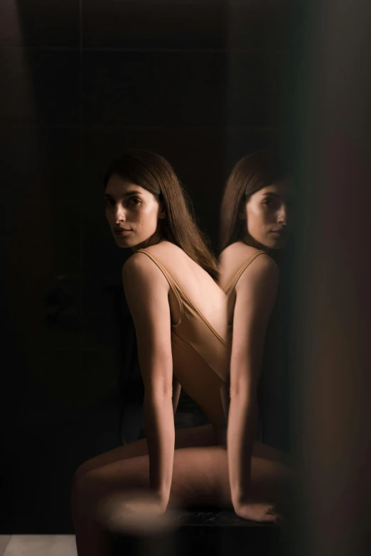 a woman sitting on a stool in front of a mirror, inspired by Elsa Bleda, hasselblad photography, 4k symmetrical portrait, bare back, (night)